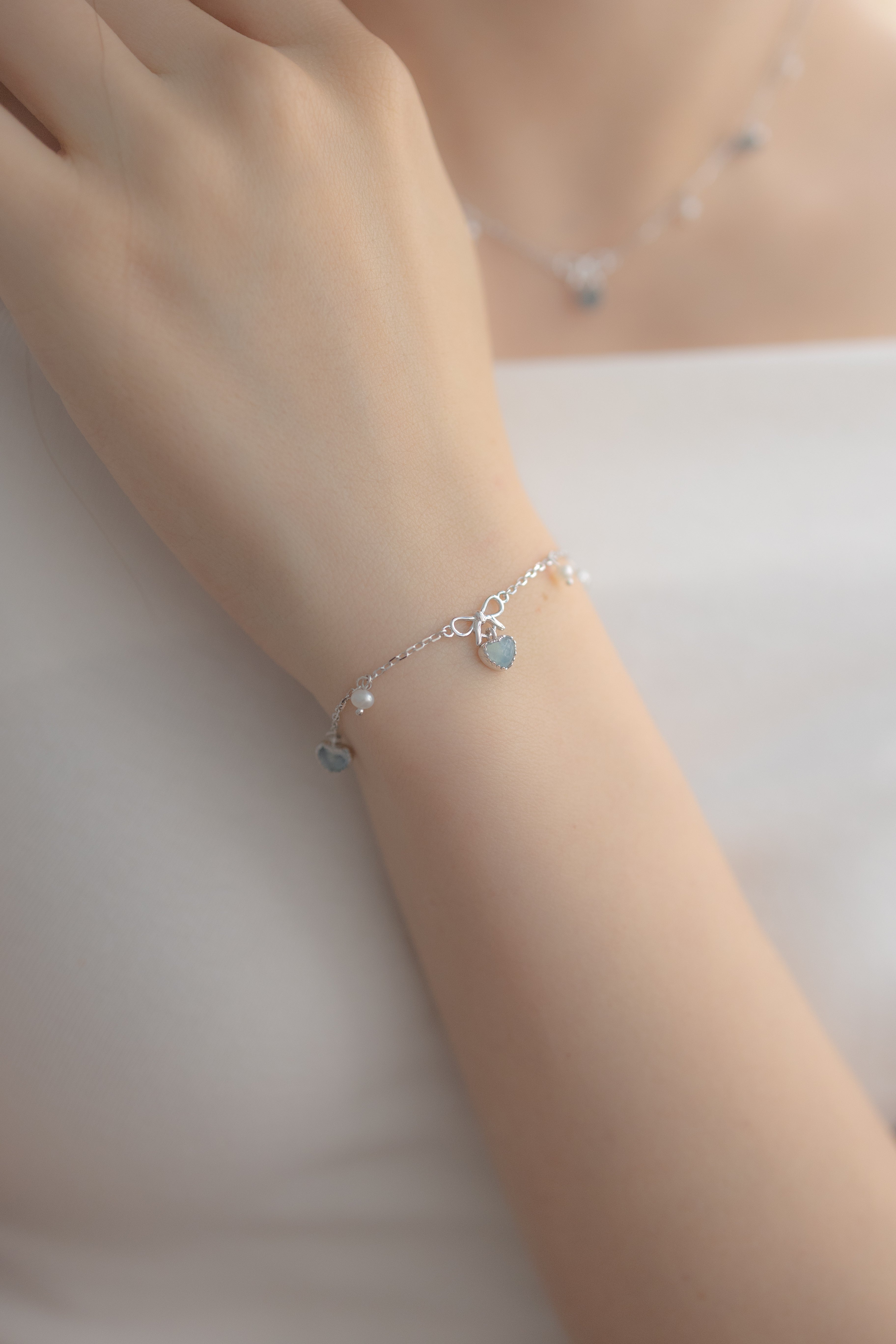 PRE ORDER SWEETHEART RIBBON SILVER BRACELET - AQUAMARINE
