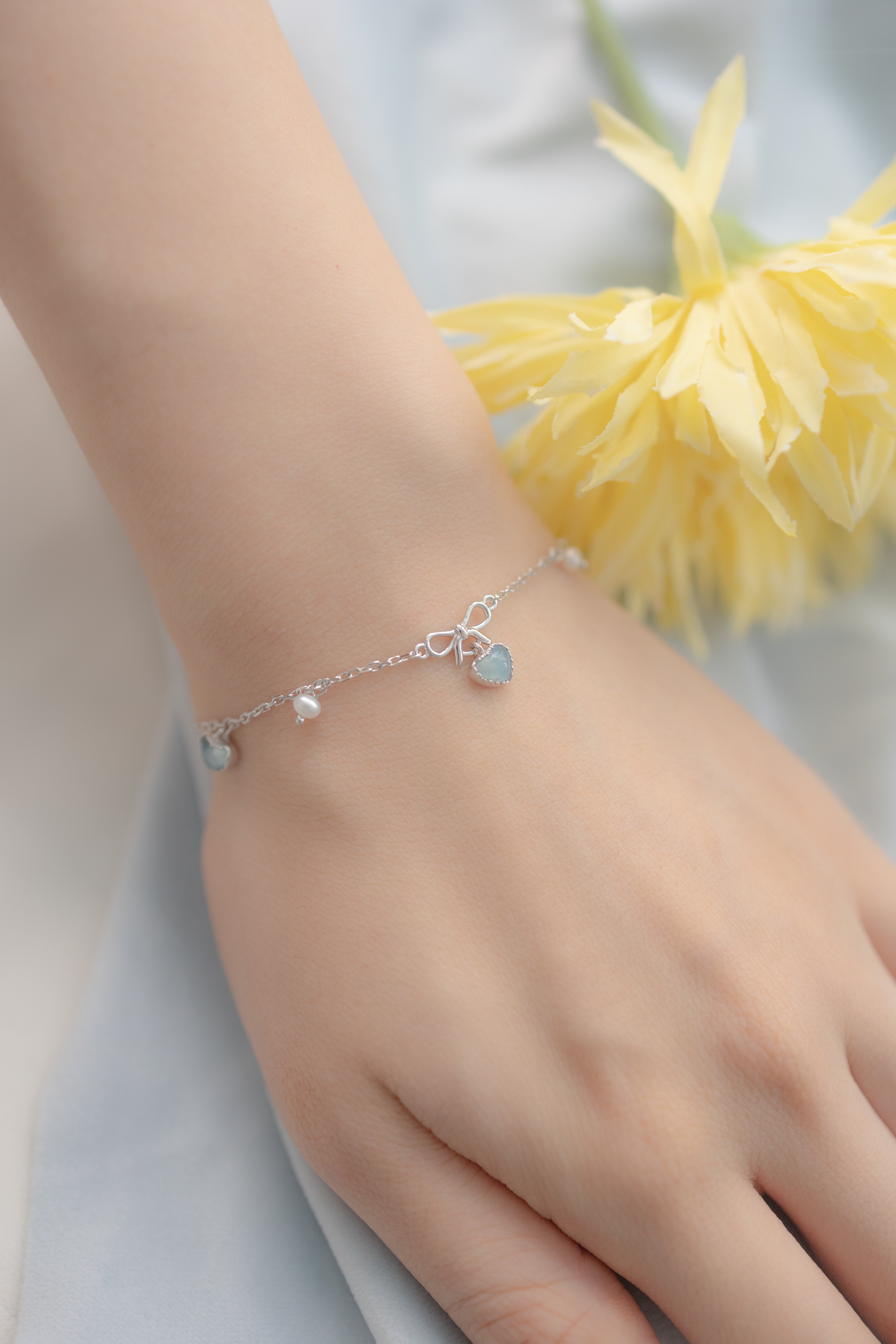 PRE ORDER SWEETHEART RIBBON SILVER BRACELET - AQUAMARINE